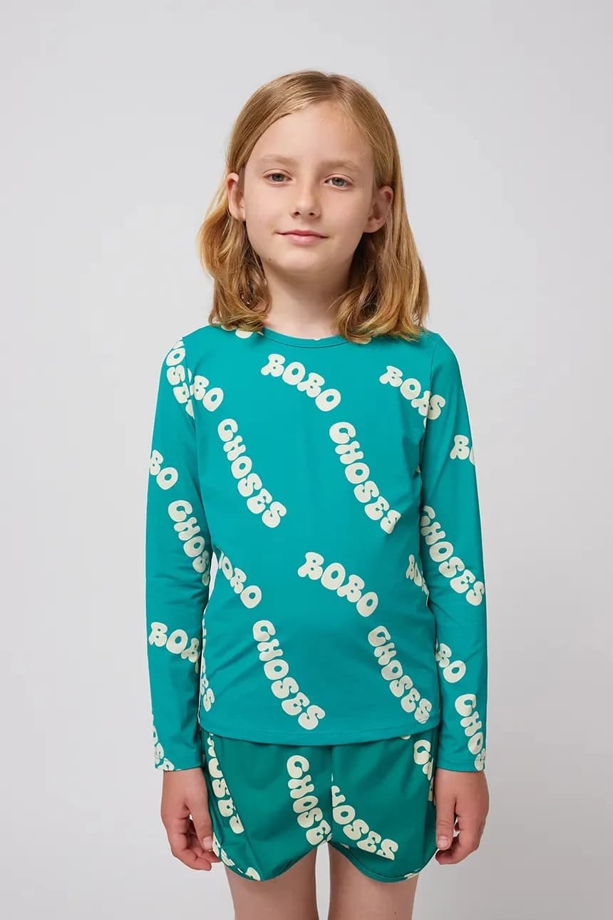 Волнистый детский купальный костюм с длинным рукавом