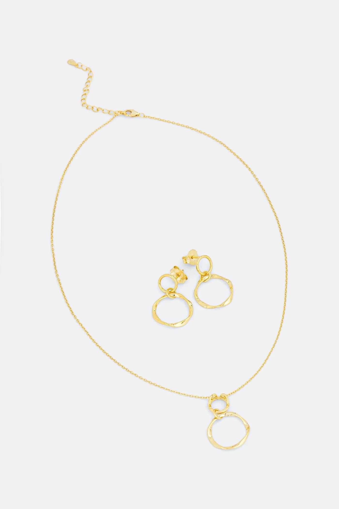 Колье и серьги из позолоченного серебра.