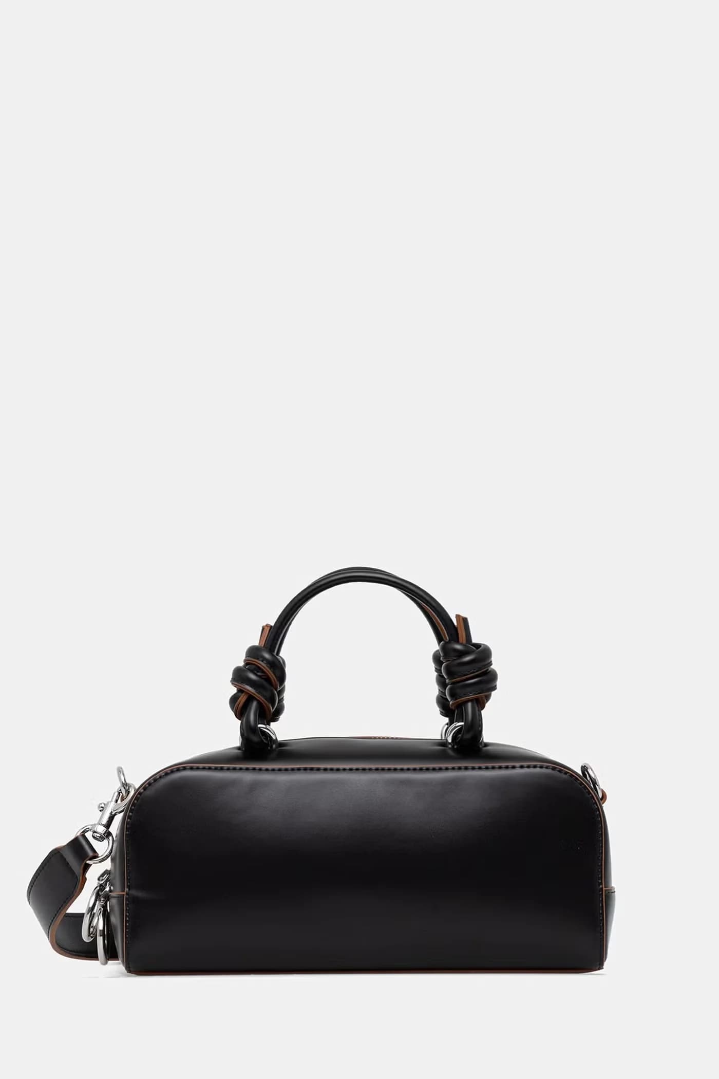 Женская сумка-круассан из искусственной кожи.